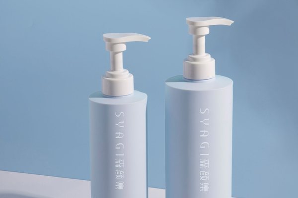 Elegant blue pump bottles lined up against a blue background.